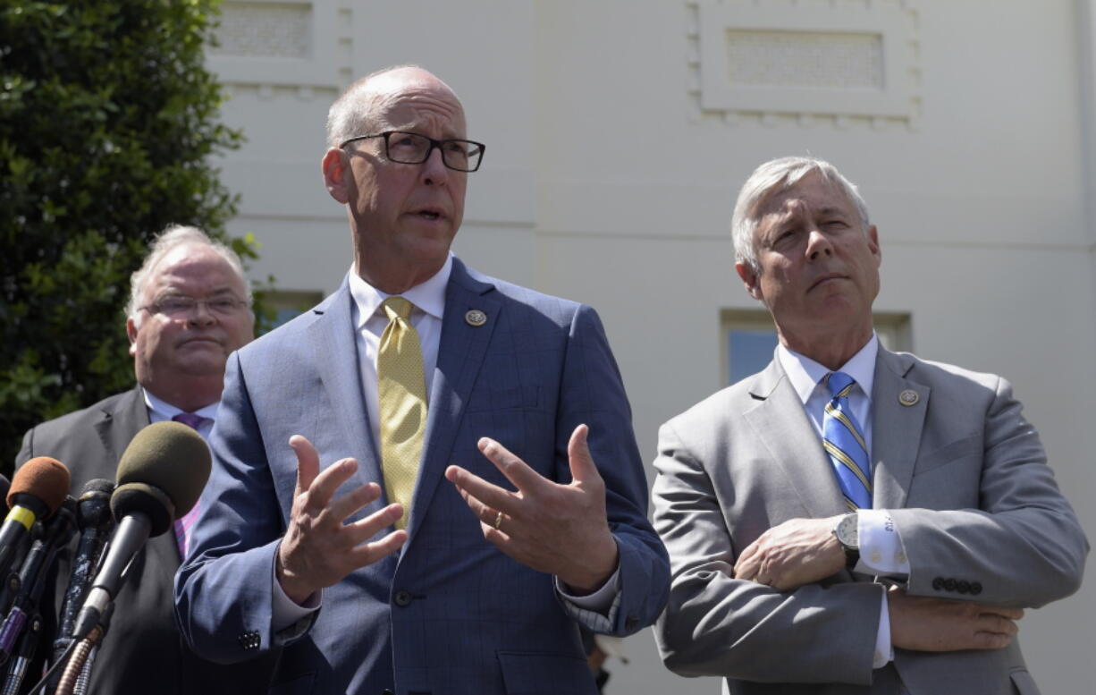 Rep. Greg Walden, R-Ore., center, flanked by Rep. Billy Long, R-Mo., left, and Rep. Fred Upton, R-Mich., speaks to reporters outside the White House in Washington, Wednesday, May 3, 2017, following a meeting with President Donald Trump on health care reform.