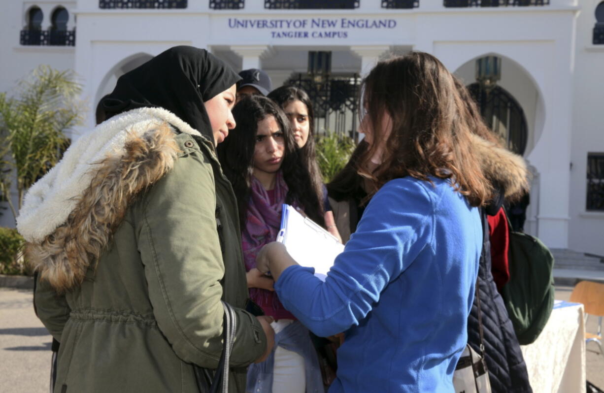 Political science major and resident assistant Clancy Phillips, right, speaks to prospective students Feb. 18 at an open house on the University of New England&#039;s satellite campus in the Moroccan coastal city of Tangier. In response to concerns about anti-immigrant sentiment, some U.S. colleges are making new efforts to help international students feel welcome and reassure them of their safety.