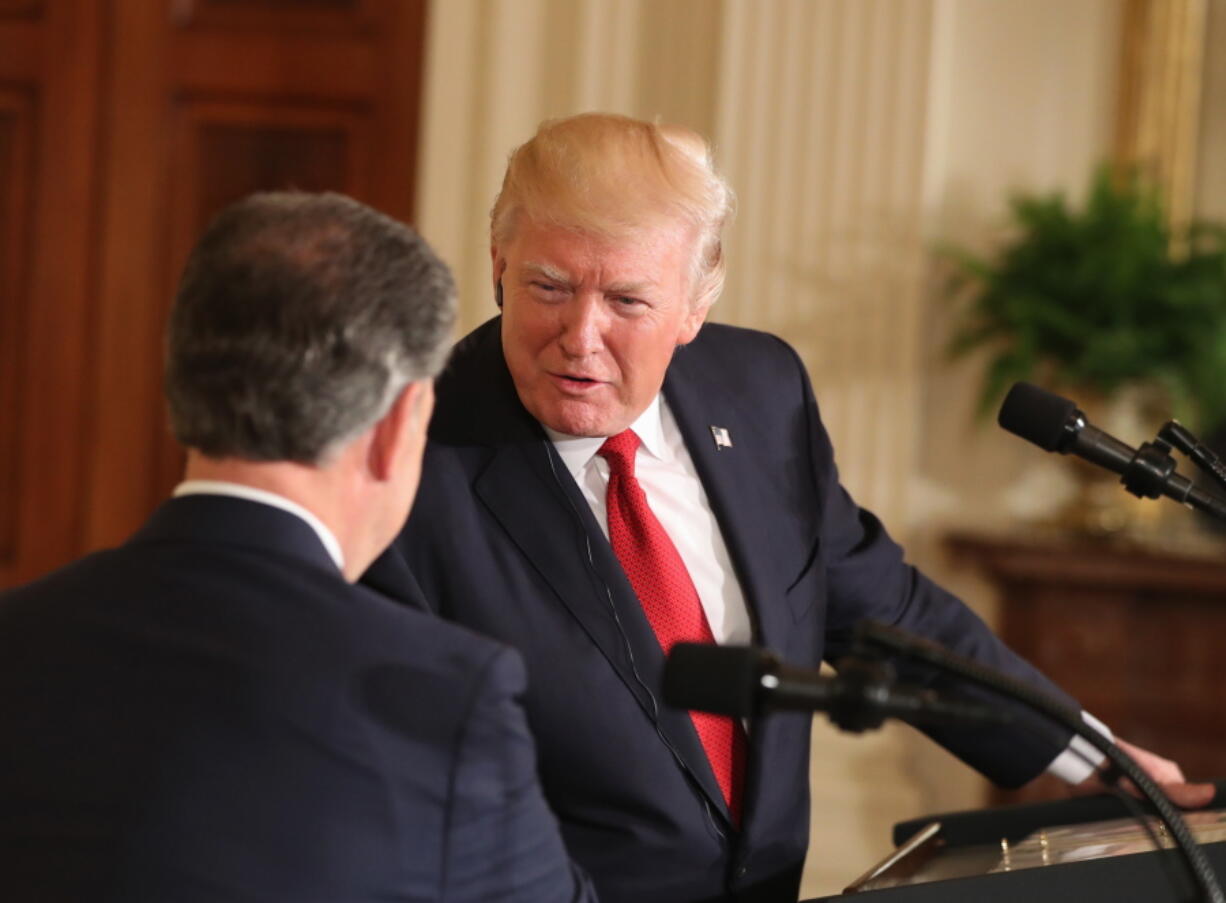 President Donald Trump shakes hands with Colombian President Juan Manuel Santos during a joint news conference in the East Room of the White House in Washington on Thursday.