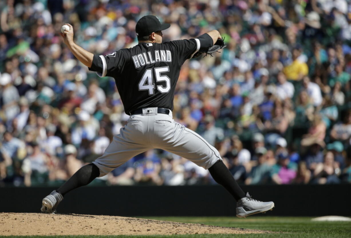 Chicago White Sox starting pitcher Derek Holland throws against the Seattle Mariners in the eighth inning of a baseball game, Sunday, May 21, 2017, in Seattle. (AP Photo/Ted S.