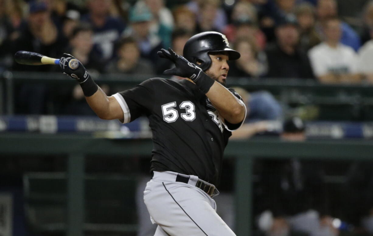 Chicago White Sox's Melky Cabrera watches his go-ahead RBI double in the 10th inning of a baseball game against the Seattle Mariners, Friday, May 19, 2017, in Seattle. Leury Garcia scored on the play. (AP Photo/Ted S.