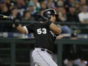 Chicago White Sox's Melky Cabrera watches his go-ahead RBI double in the 10th inning of a baseball game against the Seattle Mariners, Friday, May 19, 2017, in Seattle. Leury Garcia scored on the play. (AP Photo/Ted S.