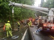 A rig full of cows overturned on Timmen Road south of La Center Tuesday morning. The truck took out a power pole and downed power lines and crews with Clark Public Utilities responded.