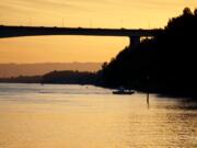 A rescue boat works at the scene of a fatal accident on the Columbia River Monday evening. A woman was killed and a man was injured when their boat struck a bridge pier and sank.