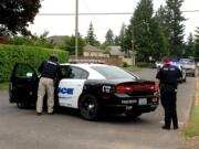 Police investigate a shooting in Vancouver on Monday afternoon. One suspect was taken into custody by police.