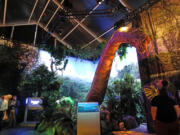 A brachiosaurus stares down on visitors May 22 at the “Jurassic World” exhibit at the Field Museum in Chicago.