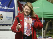 Marilee McCall, mayor pro tem of Woodland, describes her entry in the mayors’ patriotic tie contest during the 2016 Flag Day celebration at Fort Vancouver.