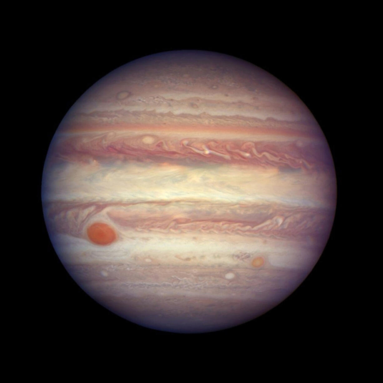 When the solar system was about 1 million years old, Jupiter’s gravity was strong enough to prevent rocks from crossing beyond its orbit. Here the planet is seen through a Hubble telescope image. A.