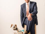 Wayne Pacelle, president and CEO of the Humane Society of the United States, poses with his dog, Lily.