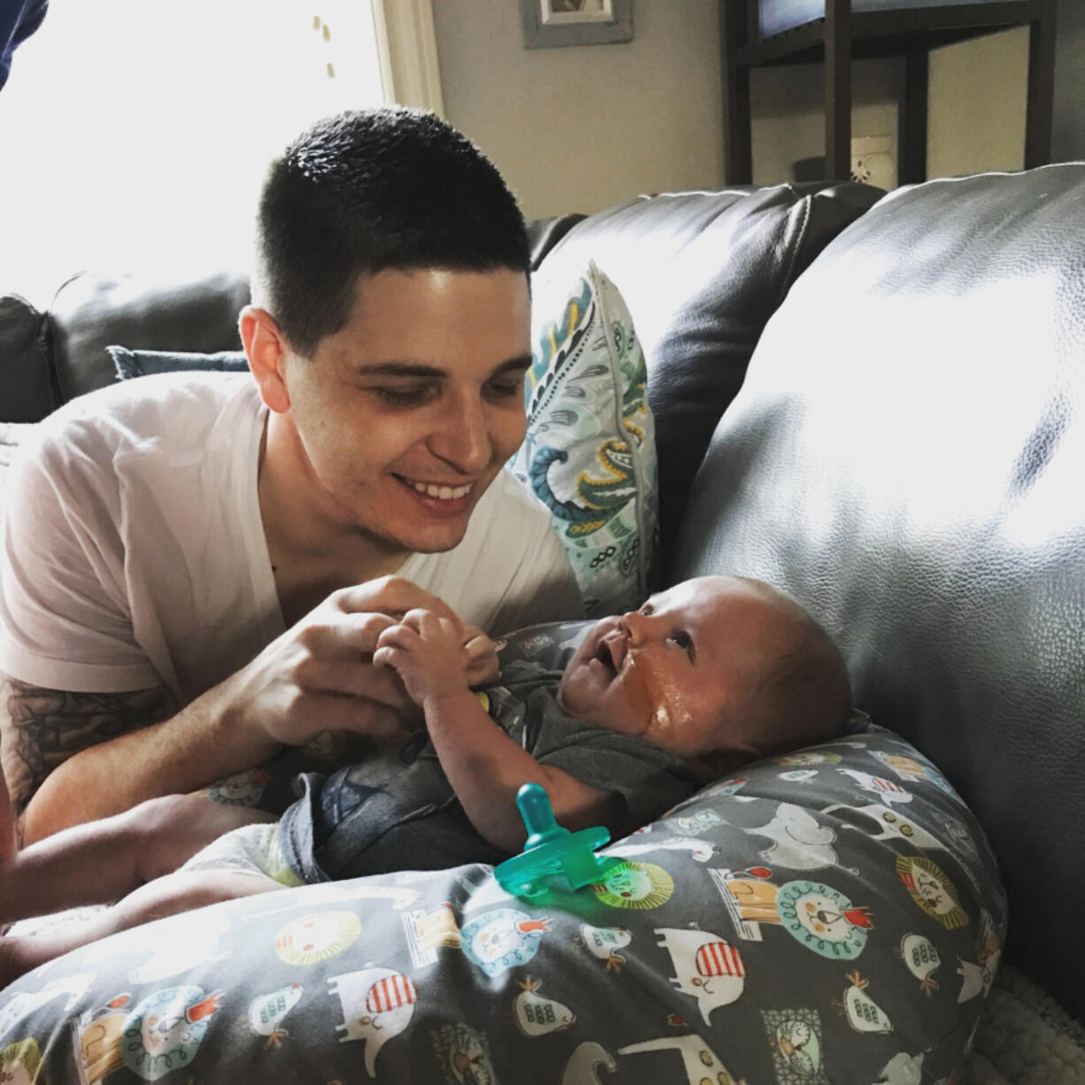 Jonas Lail plays with his son, Hudson, who died on June 1. A once-in-a-lifetime shot five days after Hudson’s death has helped Lail find peace. At top, Jonas Lail shortly after hitting a hole-in-one on the 16th hole at Royal Oaks Country Club in Vancouver.