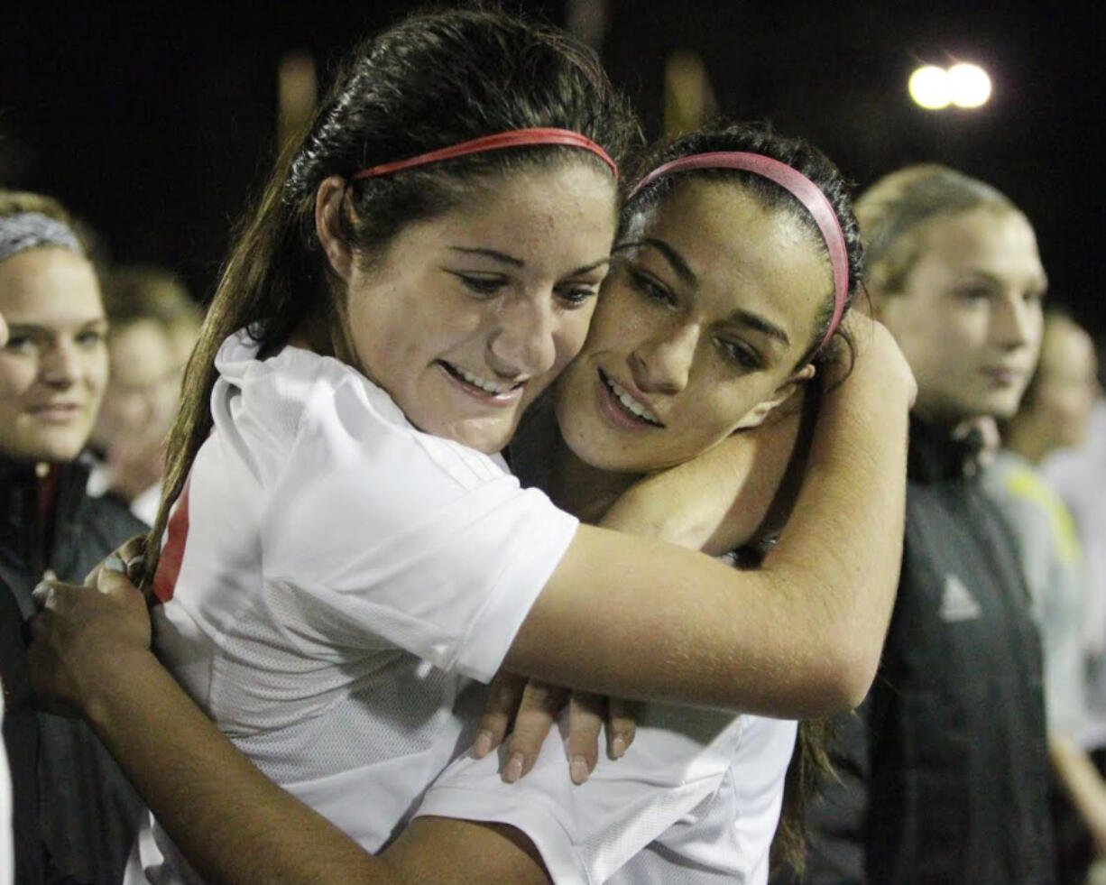 Camas' Alyssa Tomasini and Maddie Kemp celebrate a win in the 4A state semifinals (Jim Bryant/For The Columbian)