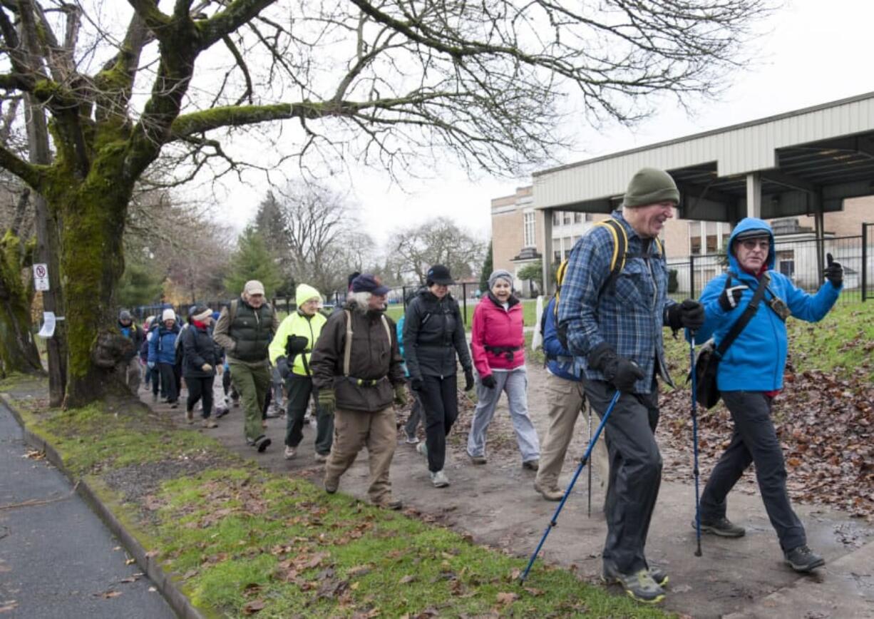 The Forever Young Hikers of Vancouver, led by Geoff Fowler, right, take an urban hike through Northwest Portland in December 2015. The group is tailored to those 50 and older and consistently has waiting lists for its outings.