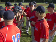 Vancouver Cardinals players gather before taking to the field against the Federal Way Buzz in the Curt Daniels Invitational Baseball Tournament.