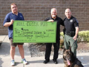 Mill Creek Pub donated $1,000 to DOGPAW to move the nonprofit more than halfway toward its goal of raising $100,000 so it can continue to maintain and operate dog parks around Clark County.