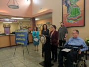 From left, SeaMar clinic manager Hope Murray and U.S. Sen. Maria Cantwell listen as Emily Cooper of Disability Rights Washington, center, talks about the American Health Care Act during a press conference Saturday at SeaMar in Vancouver. Veterans R.C. Wells and Mike Rosenbalm, right, later said that if the House-approved bill became law many veterans would suffer.