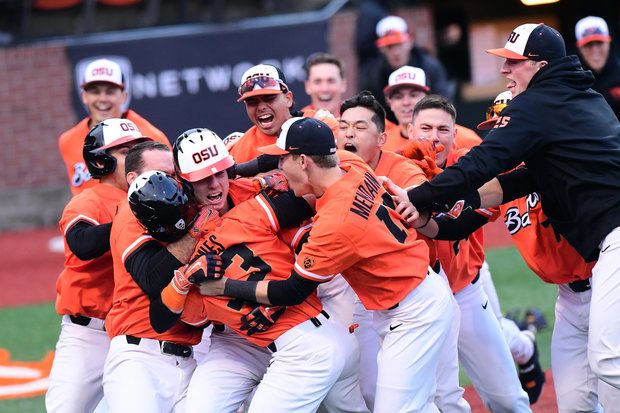 Oregon State celebrates after Preston Jones scored from second base on a wild pitch in the ninth inning to give the Beavers a 5-4 win over Arizona on March 25.