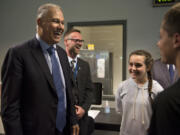 Gov. Jay Inslee, from left, talks with Odyssey Middle School Principal Aaron Smith and seventh-graders Jordan Jonason and Tai Beaulieu during a tour of the Camas campus.