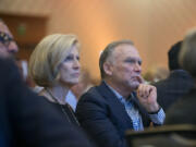 Philanthropists Michele Goodwin, left, and her husband, Greg, listen to speakers during a luncheon at the Hilton Vancouver Washington on Tuesday afternoon. They were recognized as the 2017 philanthropists of the year.