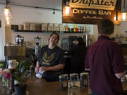 River Maiden Artisan Coffee co-owner Melissa Layman chats with a customer about having to close the shop at the end of the month. Layman and fellow co-owner Aaron Flies said they did not want to sign a 10-year lease and hope to open in a new location by fall.