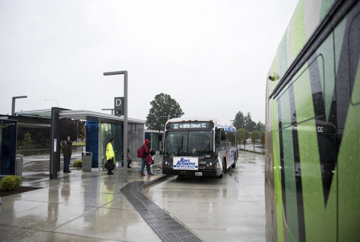 Passengers board a bus the Southside Vancouver Mall Transit Center on Thursday afternoon. The station serves The Vine as well as several other fixed routes including the 32, 7, 72, 73, 74, 78 and 80.