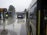 Buses idle while awaiting passengers at the southside Vancouver Mall Transit Center. The station, which was moved from the north side of the mall last January, was one of several changes C-Tran has undergone in the last year in an effort to improve its service.