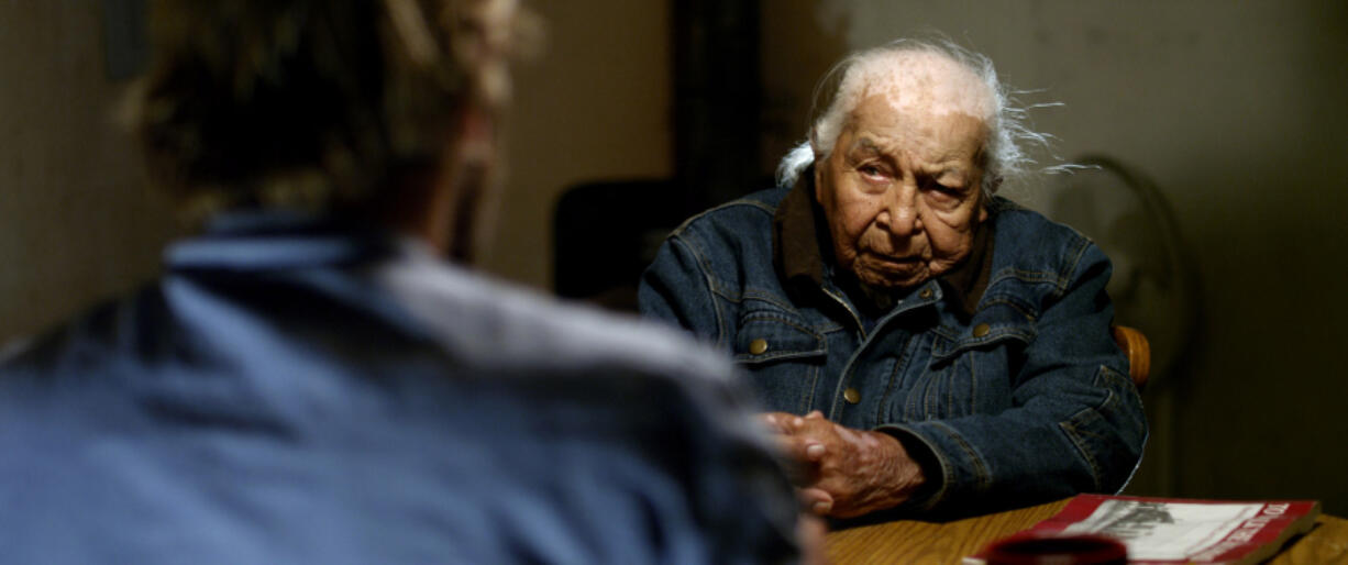 Above left: The late Dave Bald Eagle, an actual Lakota elder, was 95 years old when he portrayed a Lakota elder named Dan, who wants white novelist Kent Nerbern, portrayed by Christopher Sweeney, to write a different kind of book about American Indians.