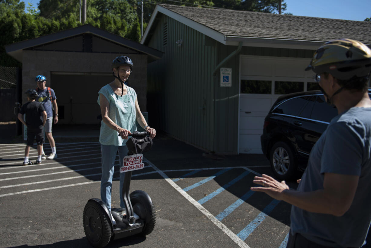 Vancouver Segway Tours co-owner and guide Ray Bouvier, or “Segway Ray,” right, teaches Barbara Splawn the basics of Segway riding before a historic tour through the Fort Vancouver National Site and downtown. Bouvier and his wife operate Vancouver’s only Segway tour company.