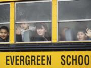 Third grade students from Crestline Elementary School get a first look at Riverview Elementary School through foggy windows of a school bus Thursday February 7, 2013 in Vancouver, Washington. Riverview Elementary welcomed 93 Crestline third-graders, teachers and administrators after their school burned down.