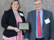 Landover-Sharmel: The Washington Association of School Administrators honored, from left, Christie BrownSilva, a parent and volunteer in Evergreen Public Schools, with a 2017 Community Leadership Award and Superintendent John Deeder with the 2017 Award of Merit.