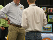 Ridgefield: A representative from the Pearson Field Education Center talks to a student at a Youth Employment Summit at the Clark County Event Center at the Fairgrounds on May 23, where teenagers learned about summer employment options, practiced mock interviews and applied for jobs.