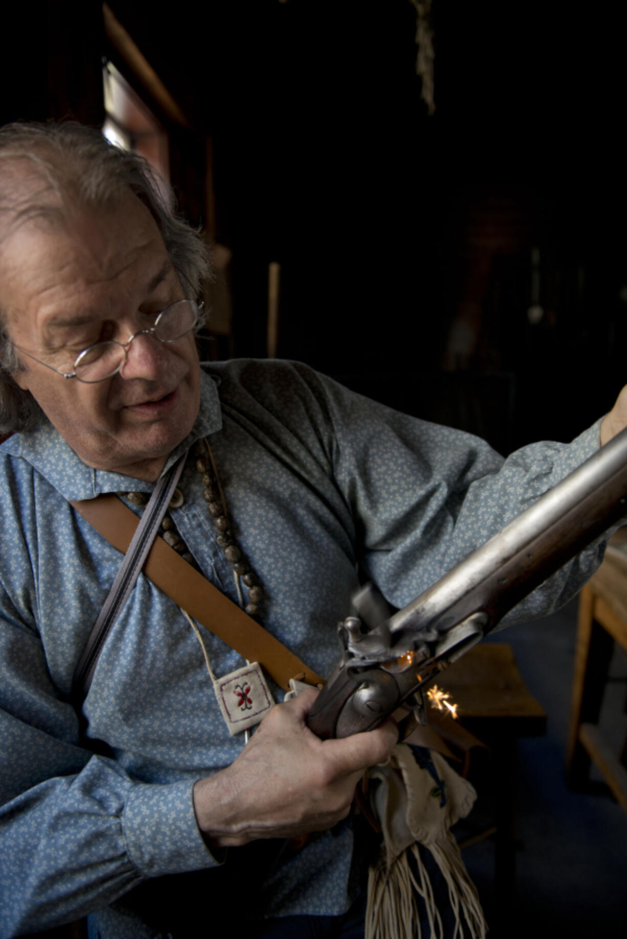 Ron Cronin, a Fort Vancouver National Historic Site volunteer, practices the flint work on a Hudson’s Bay Trade black powder musket, called a “Smoothy” for it’s smooth internal barrel, prior to a rifle demonstration Saturday at the fort.