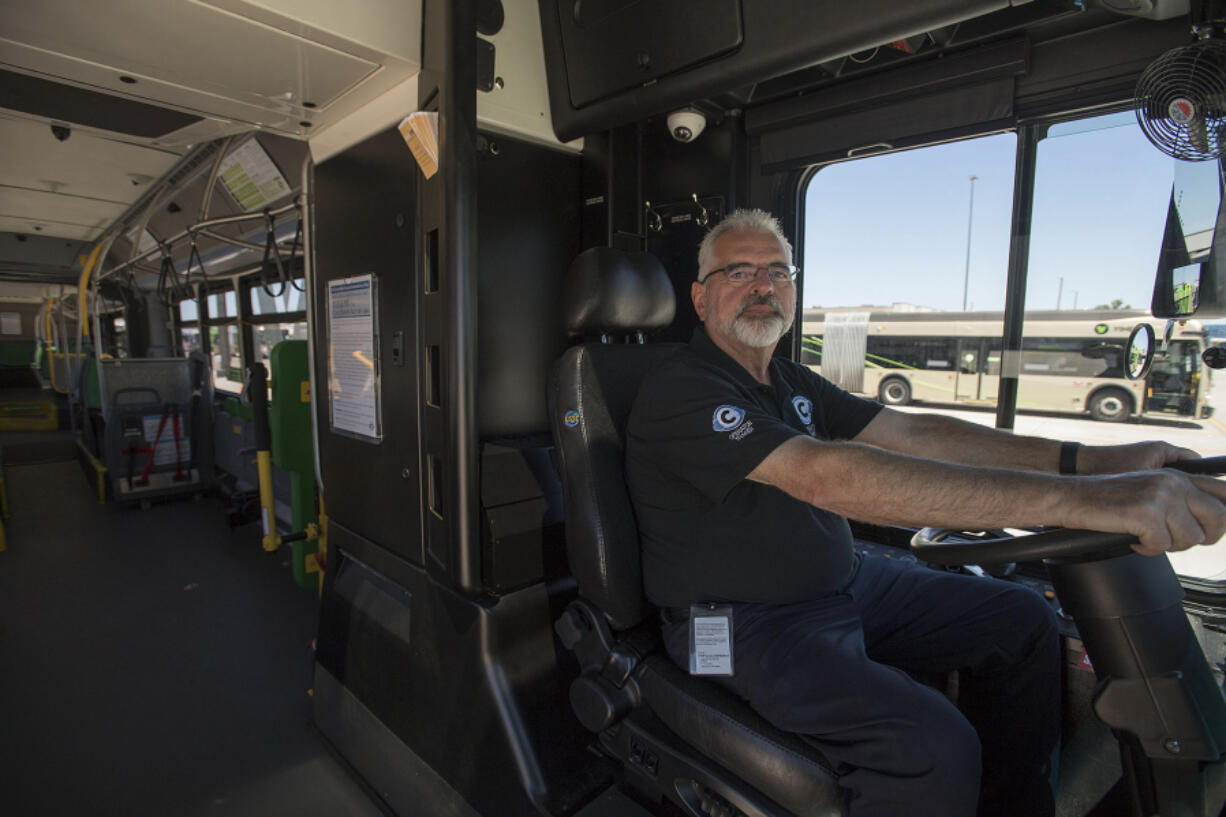 C-Tran driver trainer Randy Millikan drives an articulating bus from C-Tran headquarters Friday. Millikan said that for the last two or three years, C-Tran has had back-to-back classes of trainee operators as it works to shore up its staffing levels.