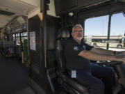 C-Tran driver trainer Randy Millikan drives an articulating bus from C-Tran headquarters Friday. Millikan said that for the last two or three years, C-Tran has had back-to-back classes of trainee operators as it works to shore up its staffing levels.