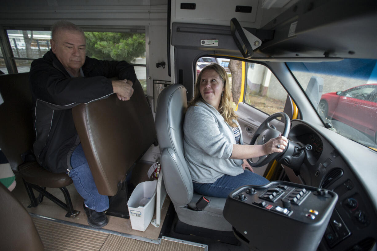 Rodney McKnight, Educational Service District 112 regional transportation coordinator, joins Jenny Bullard, director of specialized transportation, aboard a specialized school bus near district offices on June 16. The district failed 44.83 percent of bus inspections last summer due to since-fixed GPS devices that were improperly hung.