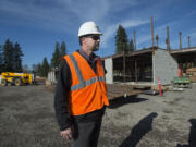 Joe Steinbrenner of the Washougal School District stands outside the new elementary school under construction in Washougal in November. The new school will be open this fall and will effect start times and bus routes for other schools in the district.