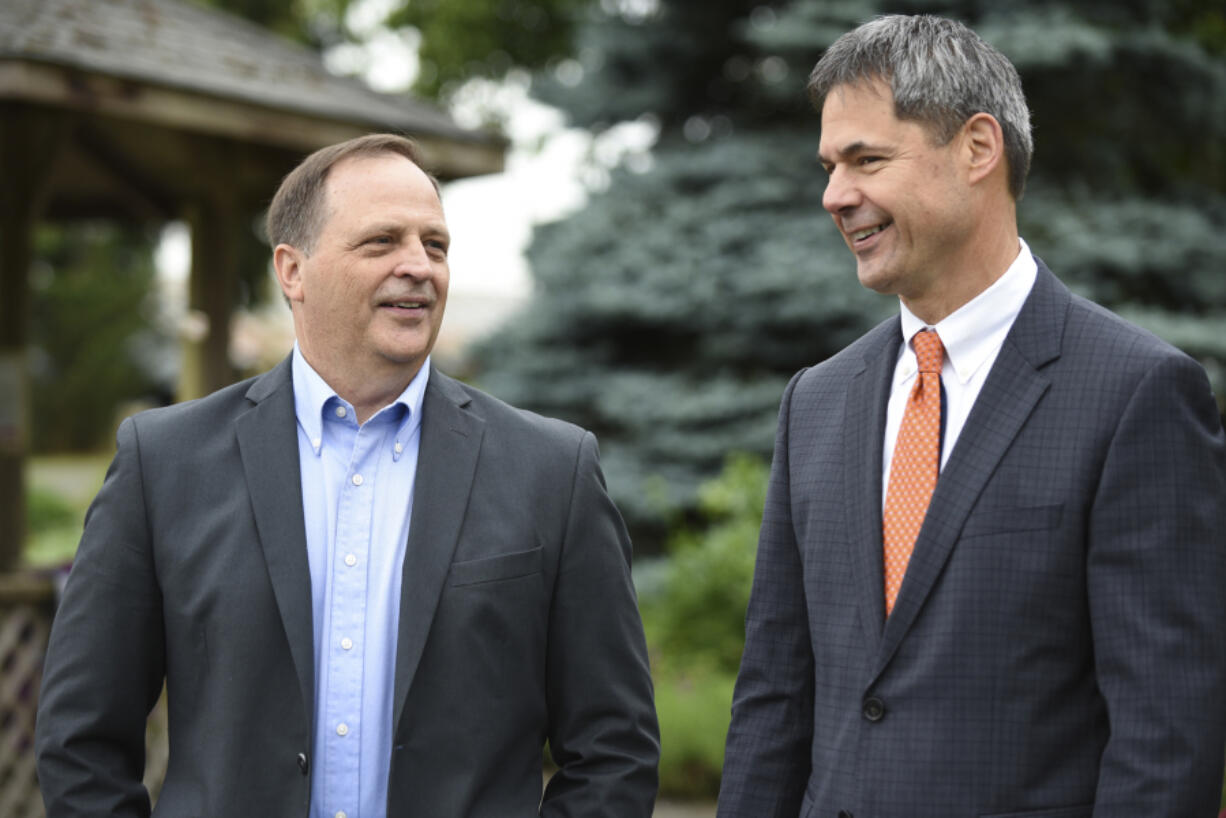 Mark Ross, the incoming superintendent of Battle Ground Public Schools, left, talks with current superintendent Mark Hottowe, who is retiring this year.