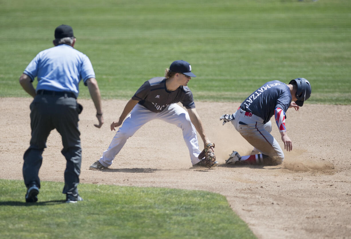 Narrows infielder Cameron MacIntosh, left, is unable to tag Showtime’s Jacob Matzat as he steals second base in the second inning during the Curt Daniels Invitational Baseball Tournament at Propstra Stadium on Thursday afternoon, June 29, 2017.