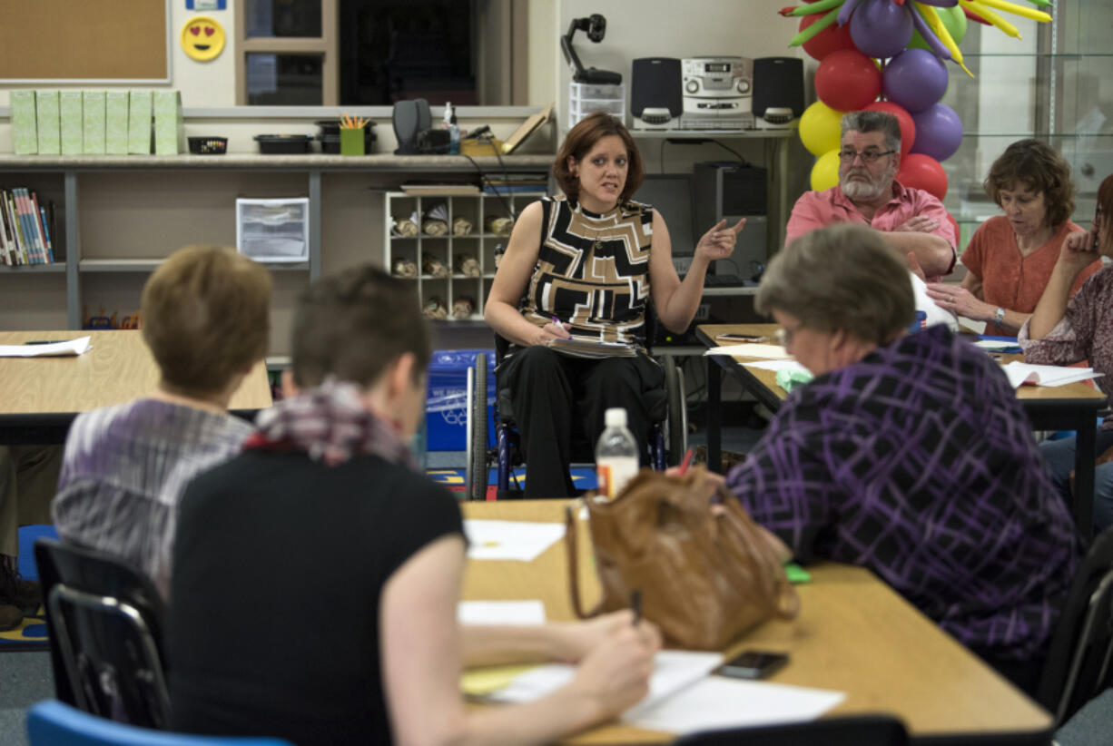 Michelle Beardshear of Vancouver leads the East Mill Plain Neighborhood Association meeting recently. After noticing that her neighborhood was declining, Beardshear took charge in creating the neighborhood association, which was recognized earlier this month by the Vancouver City Council as the 67th city neighborhood association.