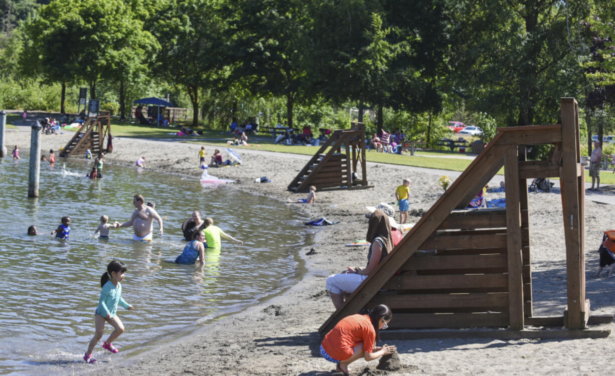 Empty lifeguard towers are seen on the beach at Klineline Pond on Thursday afternoon. Lifeguards will be on duty starting Saturday, 11 a.m. to 7 p.m., through Labor Day.