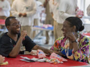 Christopher Randon, left, an inmate at Larch Corrections Center, shares a laugh with his mom, Naomi Randon of Tacoma, during its Juneteenth celebration. The prison hosted the event Saturday with food, guest speakers and poetry.