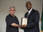 Michael Trottier, left, is presented an Award of Merit by Washington State Patrol Chief John R. Batiste during an awards ceremony at the WSP District 5 Headquarters in Vancouver on Friday. Trottier was on his way to work when he stopped to help a trooper with an emotionally distressed person attempting to jump from the state Highway 500 overpass near Interstate 5.