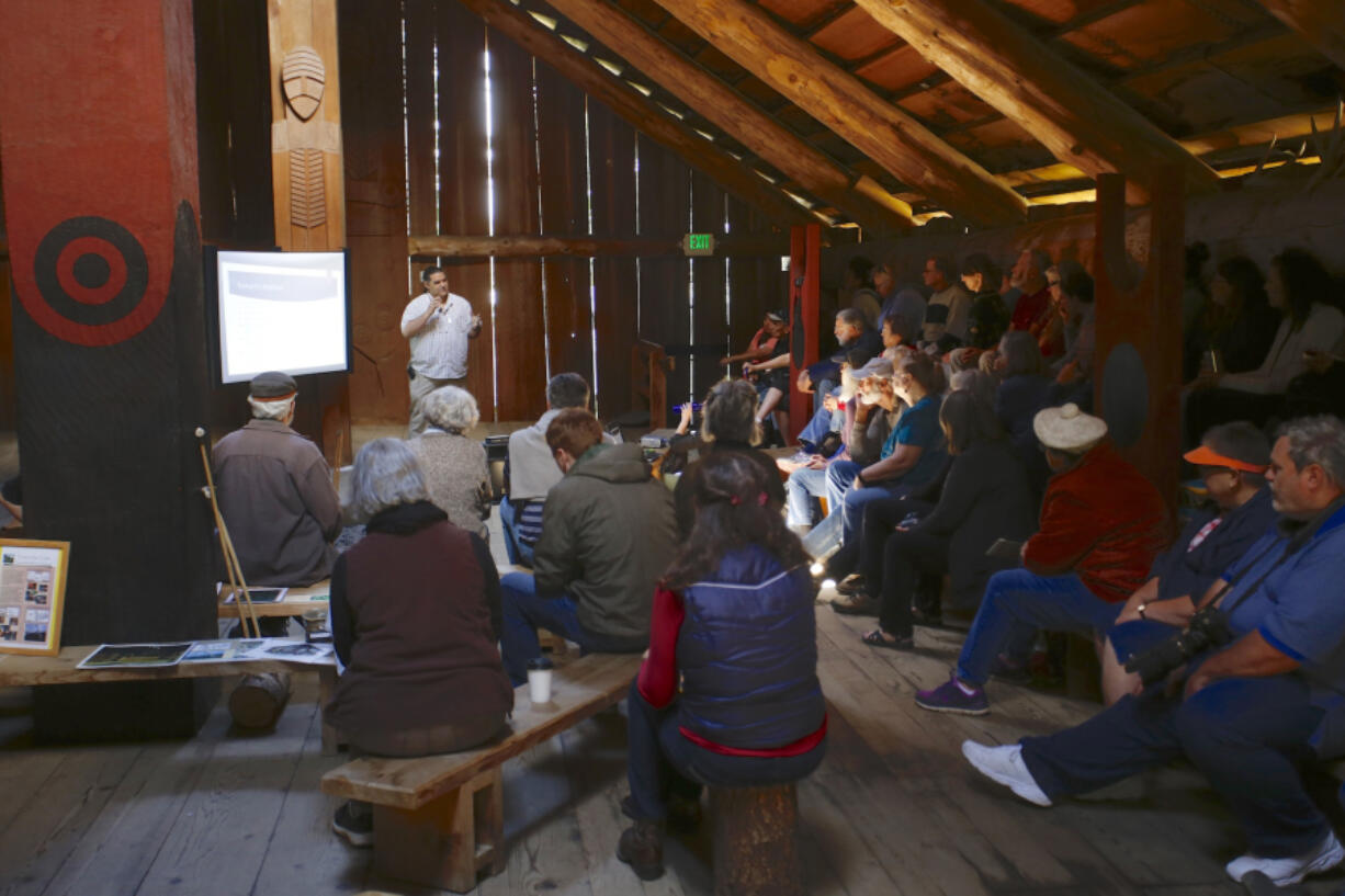 Anthropologist David Lewis talks about the colonization of Native American history by white American culture at the Cathlapotle Plankhouse at the Ridgefield National Wildlife Refuge on Sunday.