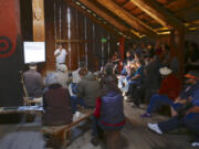 Anthropologist David Lewis talks about the colonization of Native American history by white American culture at the Cathlapotle Plankhouse at the Ridgefield National Wildlife Refuge on Sunday.