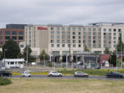 Traffic backs up as motorists prepare to approach the onramp to Interstate 5 as the Hilton Vancouver Washington conforms with the downtown landscape. With hotel developers hoping to tap into growing demand for the Columbia River waterfront, the Hilton could be joined by three more hotels by 2020.