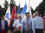 Steve Hogan, Camas mayor pro tem, from left, Ridgefield Mayor Ron Onslow, Yacolt Mayor Jeff Carothers and Vancouver Mayor Tim Leavitt display their patriotic ties Wednesday during Fort Vancouver’s 23rd annual Flag Day celebration.