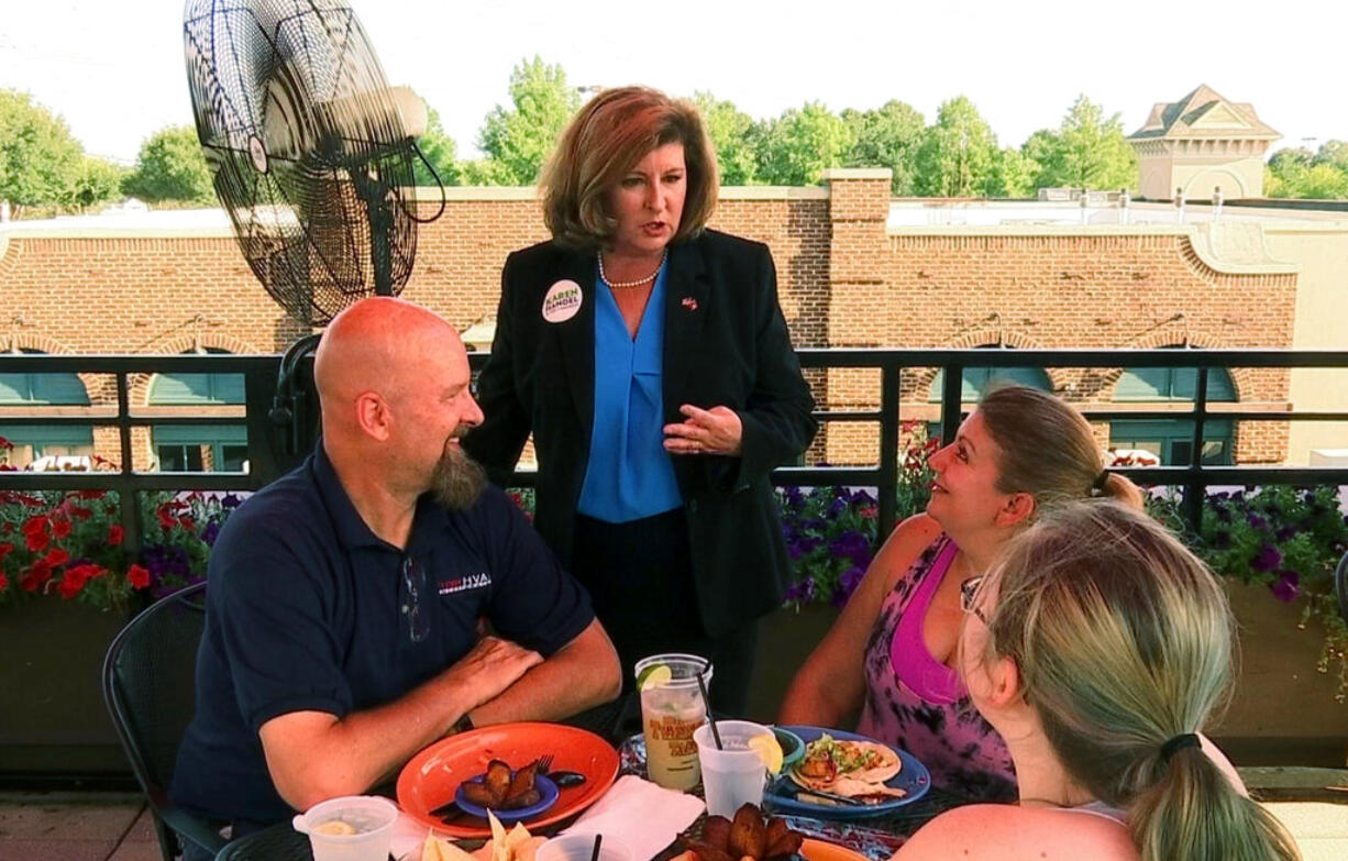 Republican Karen Handel campaigns at a restaurant in Johns Creek, Ga., Friday, June 16, 2017, ahead of runoff election to replace former Rep. Tom Price. Democrat Jon Ossoff is trying for an upset over Handel in the GOP-leaning 6th Congressional District that stretches across greater Atlanta's northern suburbs.