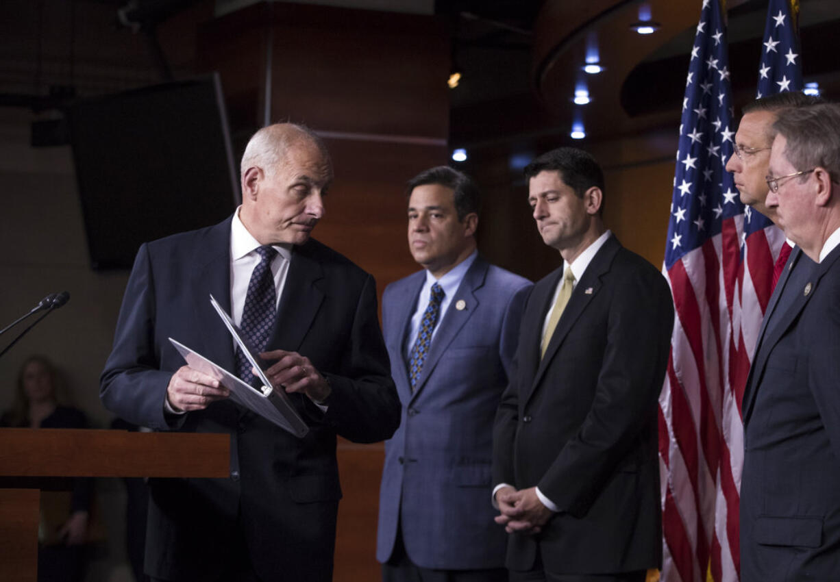 Homeland Security Secretary John Kelly, left, finishes a statement on immigration and sanctuary cities as he joins, from left, Rep. Raul Labrador, R-Idaho, chairman of the House Judiciary Subcommittee on Immigration, House Speaker Paul Ryan, R-Wis., Rep. Doug Collins, R-Ga., and House Judiciary Committee Chairman Bob Goodlatte, R-Va., during a news conference at the Capitol in Washington, Thursday, June 29, 2017. The Republican-led House pushes ahead on legislation to crack down on illegal immigration. One bill would strip federal funds from "sanctuary" cities that shield residents from federal immigration authorities, while a separate bill would stiffen punishments on people who re-enter the U.S. Illegally.  (AP Photo/J.