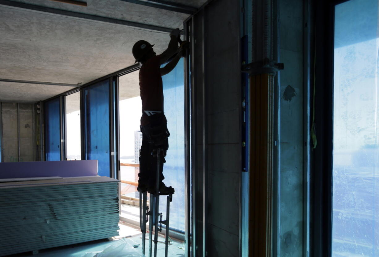 A construction worker continues work Jan. 19, 2017, at the SLS Lux in the Brickell neighborhood of Miami. U.S. employers pulled back on hiring in May by adding only 138,000 jobs, though the gains were enough to help nudge the unemployment rate down to a 16 year-low.