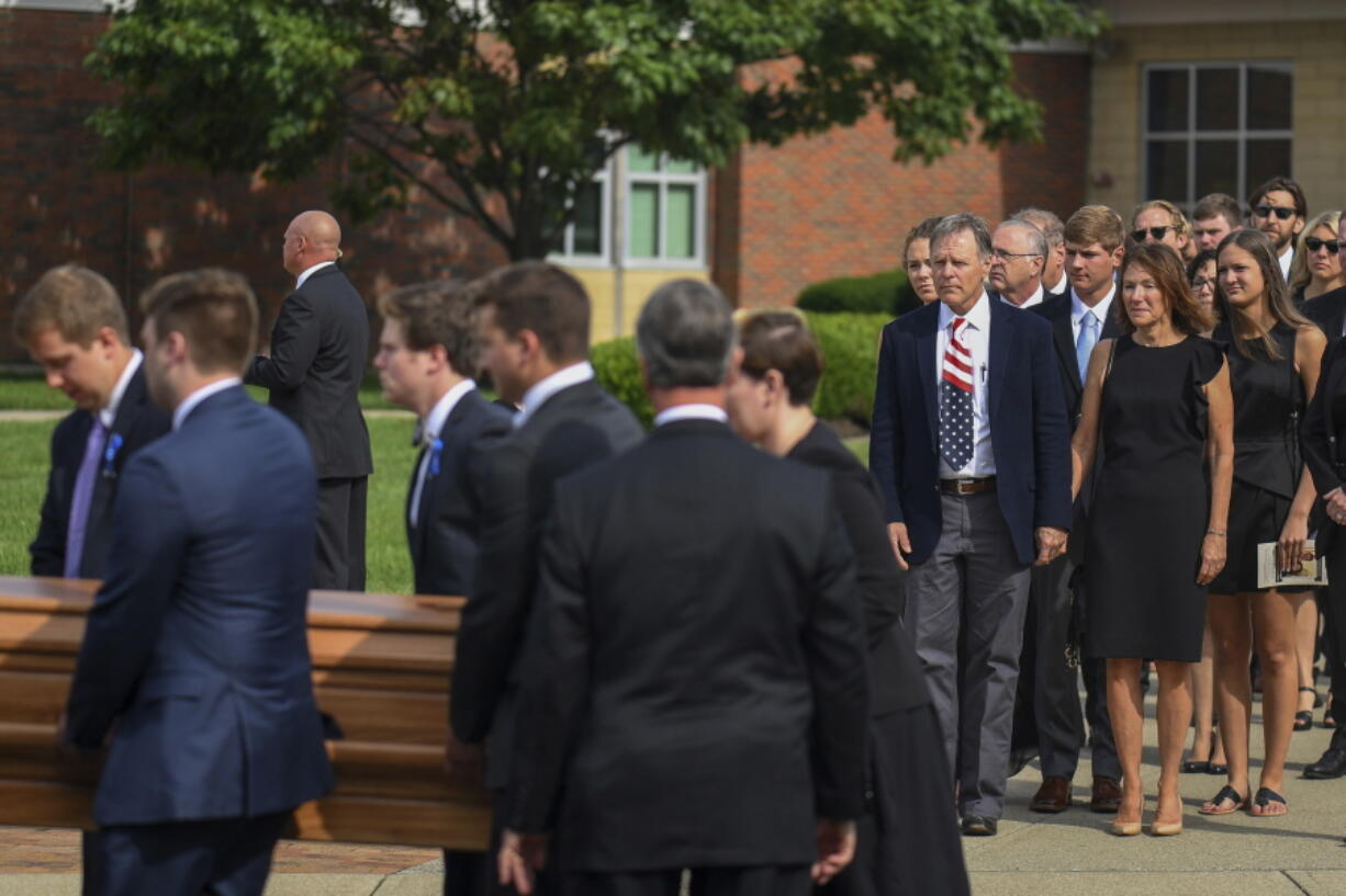 Fred and Cindy Warmbier watch as their son Otto, is placed in a hearse after his funeral Thursday in Wyoming, Ohio. Otto Warmbier, a 22-year-old University of Virginia student who was sentenced in March 2016 to 15 years in prison with hard labor in North Korea, died this week, days after returning to the United States.