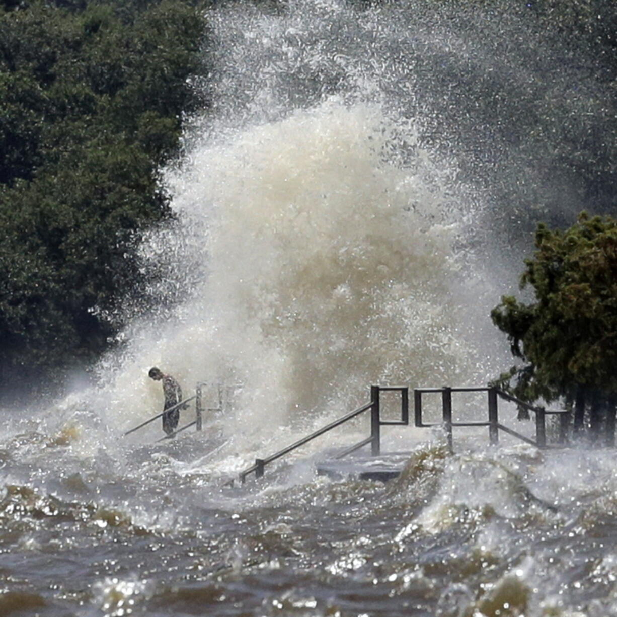 Wth a rising tide, strong southerly winds from Tropical Depression Cindy lash the lakefront Thursday, June 22, 2017 in Mandeville, La.